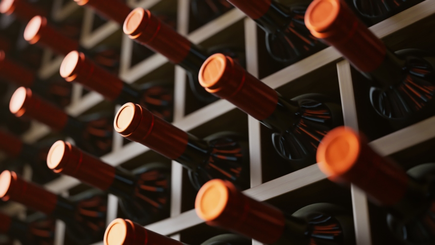 Seamless looping animation of wine bottles ordered on wooden shelves in a dark wine cellar. Concept of traditional winemaking in the winery. Large storage of wines in vineyard or restaurant. Royalty-Free Stock Footage #1081258643