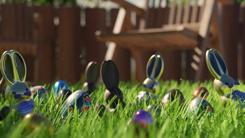Concept of Easter egg hunt. Cute chocolate Easter bunnies and eggs are hidden in green grass on the backyard. Traditional candies while spring celebration. Happy Easter. Joy. Gift. Funny game for kids