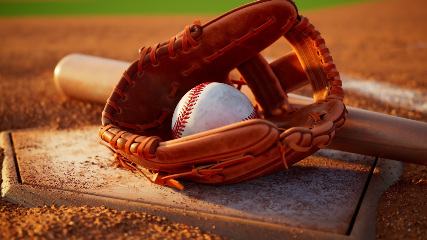 Baseball home plate with baseball, mitt and bat. Home base with baseball accessories. Camera zooming out sports gear. Beautiful soft warm light. Brake in a game. Major League Baseball. American sport