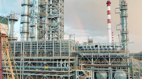 Oil-processing plant with a rainbow above it