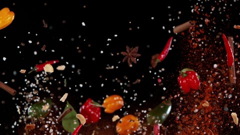 Super Slow Motion Shot of Flying Mix Spices.. Isolated on Black Background. Speed Ramp Effect. Filmed on high speed cinema camera, 1000fps.