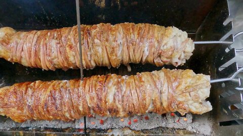 Lamb intestines and giblets roasted on spit to prepare Turkish dish kokorech