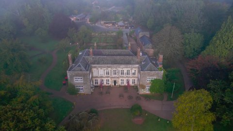 Foggy view for Cockington Court from a drone, Paignton, Torquay, Devon, England, Europe