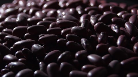 Red beans gyrating with a intimate light, rotation