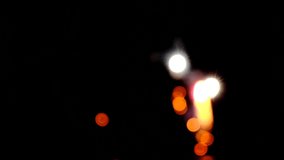 Floating light spots on black background.Glowing bokeh on black background.Blurred fireworks in warm golden tones - Powered by Shutterstock - Get 15% off with code: PIKWIZARD15