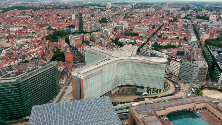 Headquarters of the EU Commission Berlaymont in European Quarter. Establishing Aerial View of Brussels Downtown with Political Landmarks - Office buildings in Bruxelles, Belgium. 4K drone zoom in shot Royalty-Free Stock Footage #1081312589