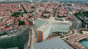 Headquarters of the EU Commission Berlaymont in European Quarter. Establishing Aerial View of Brussels Downtown with Political Landmarks - Office buildings in Bruxelles, Belgium. 4K drone zoom in shot - Powered by Shutterstock - Get 15% off with code: PIKWIZARD15