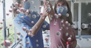 Animation of covid virus cells over caucasian senior woman and nurse wearing face masks exercising. global covid 19 pandemic concept digitally generated video.