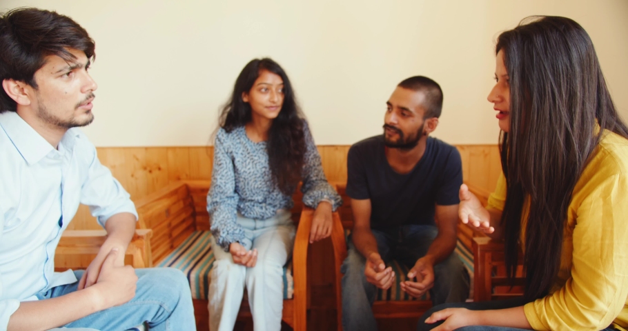 A discussion of Indian friends around the table