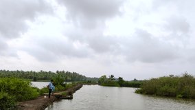 Two people fishing in a lake in Kerala.Beautiful video footage from Kerala