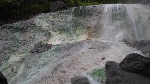 Hot natural thermal waterfall in Kuril island in Iturup island in Russia.