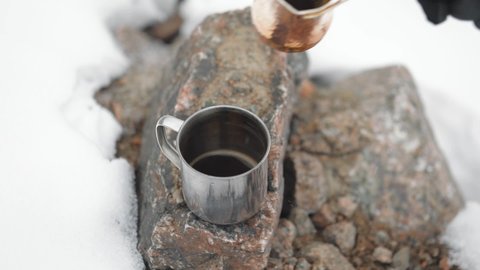Copper Cezve for coffee in winter mountains
