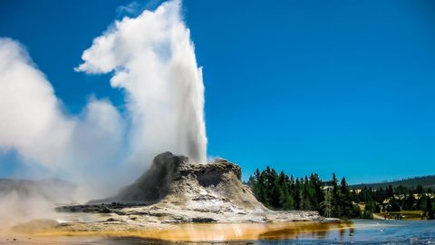 Castle Geyser erupts with hot water and steam with pools of thermophilic bacteria and it's a cone geyser in the Upper Geyser Basin of Yellowstone National Park, Wyoming United States. Cinemagraph loop