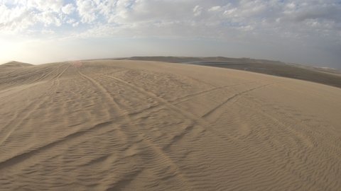 Desert safari adventure at Khor Al Udeid, Persian Gulf, Middle East. Desert landscape sand dunes near Qatar and Saudi Arabia. Inland sea is a major tourist destination for Qatar.