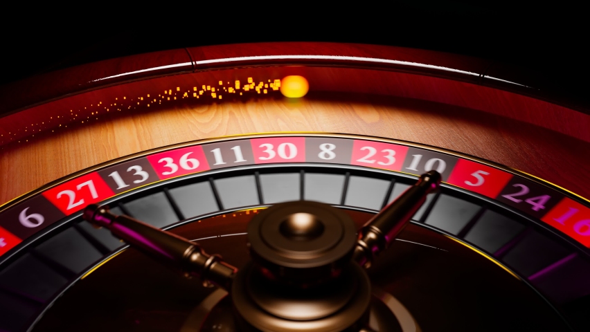 Close up shot of a spinning roulette. Presentation of a luxury casino roulette wheel with a yellow spinning fireball. Polished, elegant roulette with golden elements in Las Vegas. Gambling. Lucky game | Shutterstock HD Video #1081384121