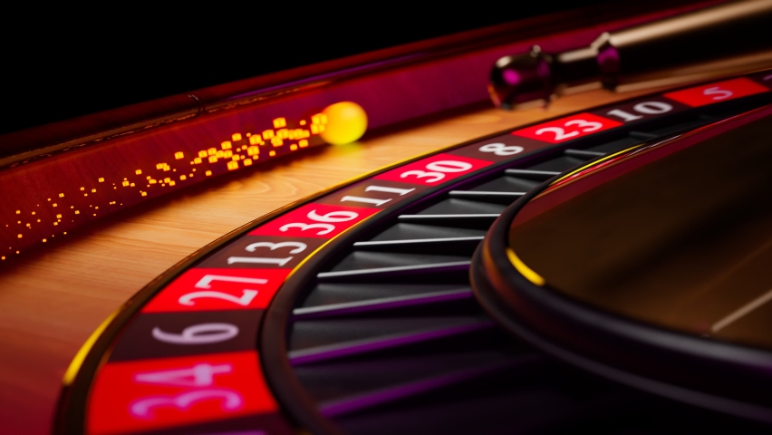 Close up shot of a spinning roulette. Presentation of a luxury casino roulette wheel with a yellow spinning fireball. Polished, elegant roulette with golden elements in Las Vegas. Gambling. Lucky game | Shutterstock HD Video #1081384127