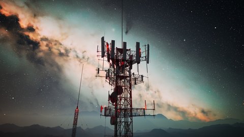 Loopable 360deg spin around an antenna complex. Radio masts support antennas for telecommunications, broadcasting, television. Tall Structures with mountains and starry sky in the background.