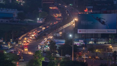 Pune, Maharashtra  India - 4th October, 2021 - Busy Traffic on a Busy road, stalls along side the road and big sign board