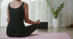 Woman teaching yoga online first step is meditation zen for working out at home in living room fitness, fit sport workout by exercise yoga during covid19 pandemic, Sports healthy lifestyle concept