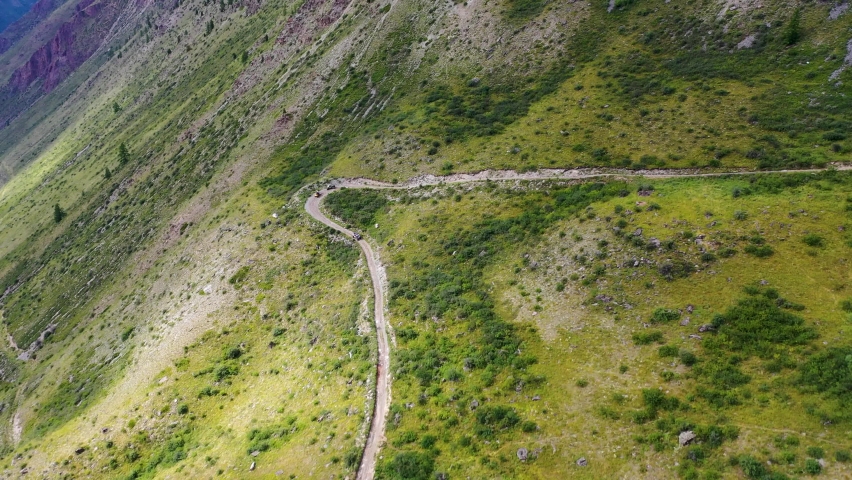 Circular panorama of the mountain serpentine along which quad bikes are traveling