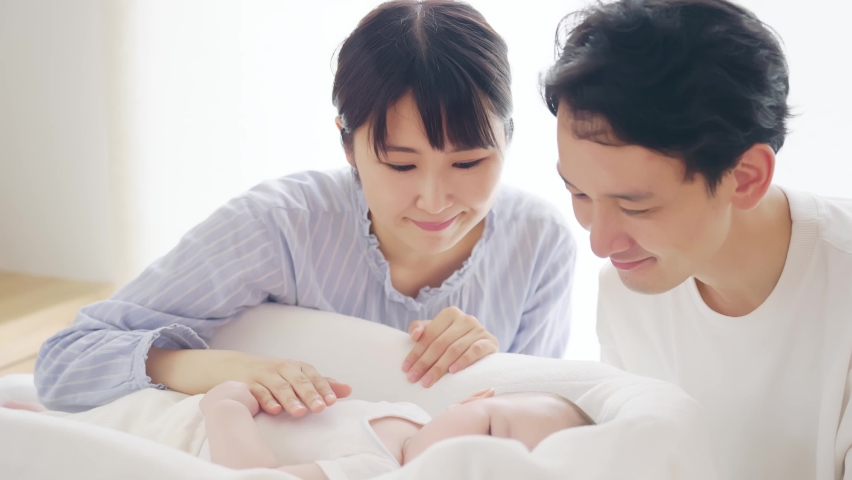 Asian parents and baby in the room. Child rearing concept. Royalty-Free Stock Footage #1081391651
