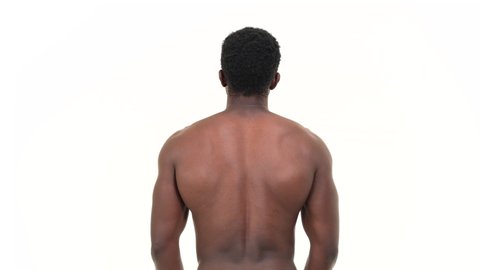 Back view of black man flexing his biceps. Isolated on a white background.