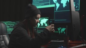 Young Asian Woman Hacker Using Mobile Phone During Hacking Computer, Code On Multiple Computer Screens
 - Powered by Shutterstock - Get 15% off with code: PIKWIZARD15