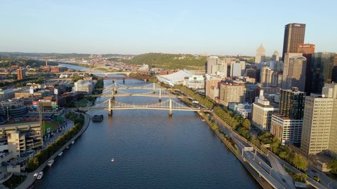 Pittsburgh , United States - 07 26 2021: Aerial drone view towards the bridges on the Allegheny river, in Pittsburgh, USA