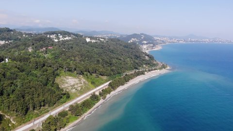Aerial video shooting from a drone. View of the Sochi. City beach where people relax.