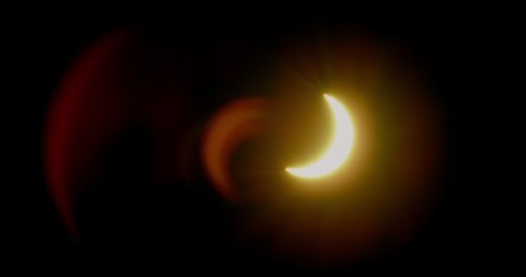 Solar Eclipse of the sun with eerily defined crescent shaped lens flares.  The Great American Solar Eclipse of 2017.