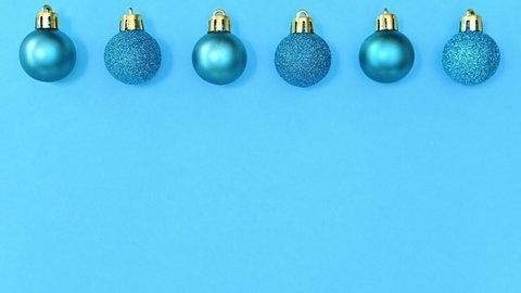 6k Monochrome blue Christmas ornaments rotate in row on top of blue theme. Stop motion 