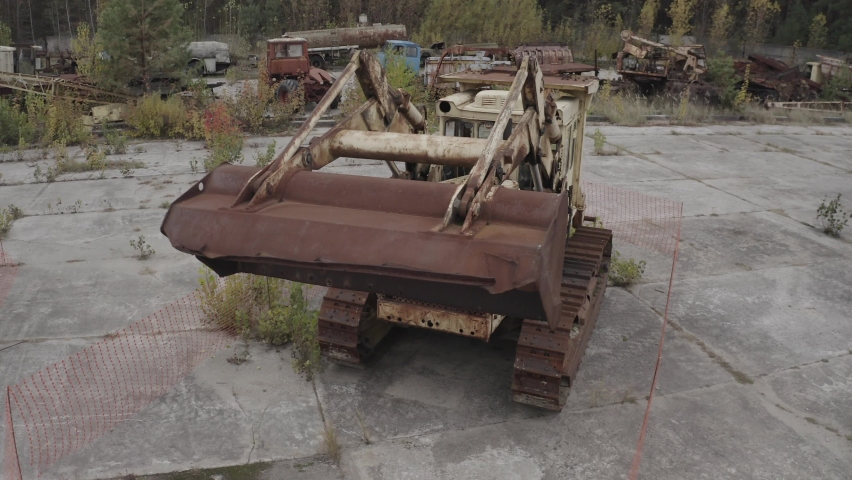 Cemetery of technology in the zone of the alienation of Chernobyl aerial photography of wrecked trucks. Pripyat. Transport that participated in the liquidation of the Chernobyl accident.