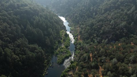 North Fork American River Between Verdant Mountains In Auburn Near Sacramento, California, USA.- aerial