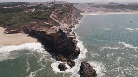Nazare Lighthouse and Fortress of Saint Michael the Archangel, Portugal. Panoramic aerial view