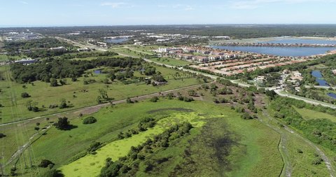 Drone video of Venice Florida near Interstate 75 and Border Road shows built communities and new construction and land clearing taken October 2021.
