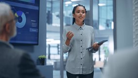 Diverse Office Product Presentation: Successful Black Female Digital Entrepreneur Uses TV Screen with Big Data, Statistics, Talks about Company Growth, Discusses Strategy with Investors, Managers - Powered by Shutterstock - Get 15% off with code: PIKWIZARD15