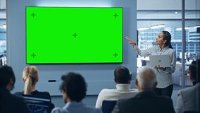 Modern Product Presentation Event: Black Businesswoman Speaks, Uses Green Chroma Key Screen Wall TV. Press Conference for Group of Diverse Investors, Digital Entrepreneurs, Businesspeople - Powered by Shutterstock - Get 15% off with code: PIKWIZARD15