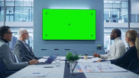 Office Conference Room Meeting using Green Screen Chroma Key TV: Multi-Ethnic Group of Top Managers, Executives Talk. Businesspeople Work on an e-Commerce Strategy. Medium Wide Static