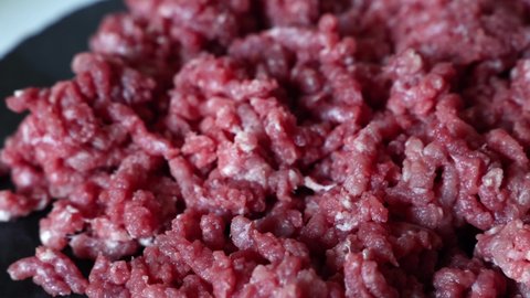 Fresh Ground Beef Rotates On A Slate Board. Cooking Minced Meat At Home In The Kitchen.