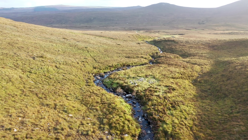 Beatiful stream flowing from the Mountains surrounding Glenveagh National Park - County Donegal, Ireland. Royalty-Free Stock Footage #1081475096