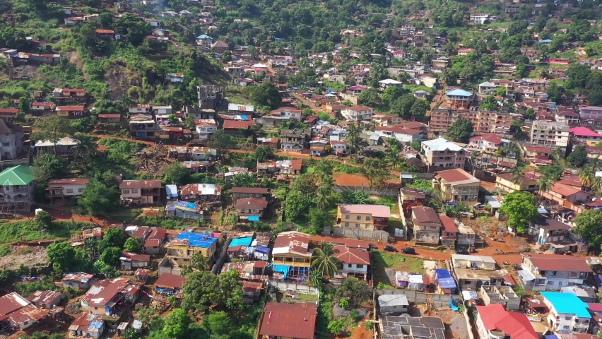 Aerial mountain homes Freetown Sierra Leone. West Africa suffers extreme poverty and hunger. Congested crowded homes and businesses. Tropical climate. 