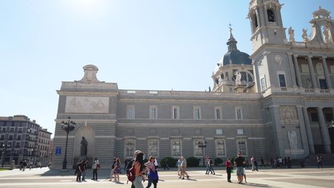 Madrid, Spain - October 19, 2021. Tourist visiting famous landmark Almudena Cathedral and royal Palace in Madrid, Spain. High quality 4k footage