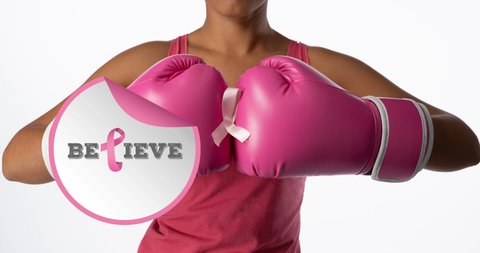 Animation of breast cancer awareness text over biracial female boxer. breast cancer positive awareness campaign concept digitally generated video.