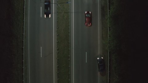 dark gray a dark gray car randomly changes the track along the road. dangerous situation on the road, drunk driving. emergency driving, driving without a driver's license. 4k aerial view 