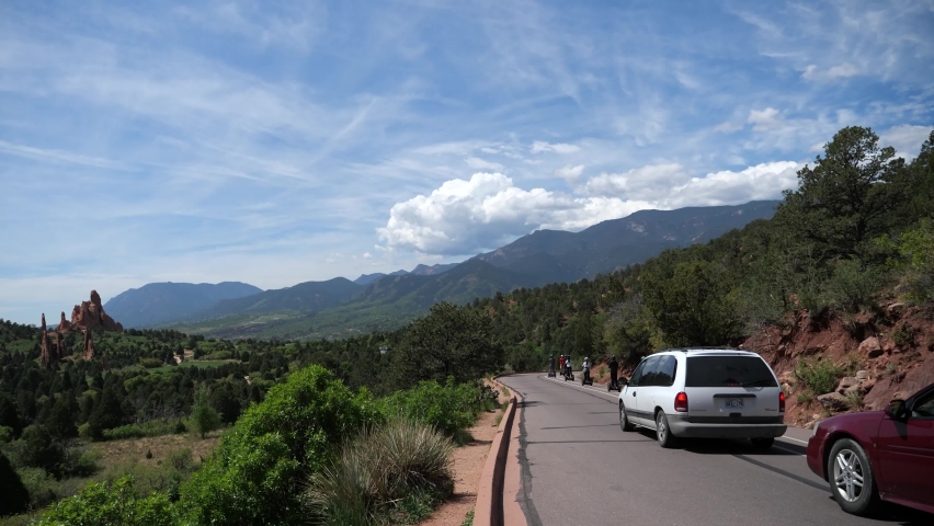 Garden of the Gods, Colorado Springs   

Automobile traffic following a tour of 2 wheel transportation vehicles
