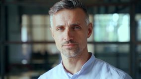 Confident handsome mature mid aged businessman professional financial advisor, executive leader, manager, male lawyer or man entrepreneur standing in office posing for headshot business portrait. - Powered by Shutterstock - Get 15% off with code: PIKWIZARD15