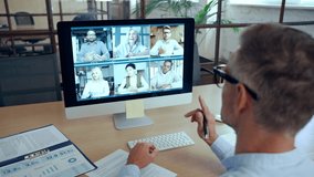 Corporate leader manager leading videoconference with diverse team business people having digital group video call conference working in office at online virtual meeting on pc computer. Over shoulder - Powered by Shutterstock - Get 15% off with code: PIKWIZARD15