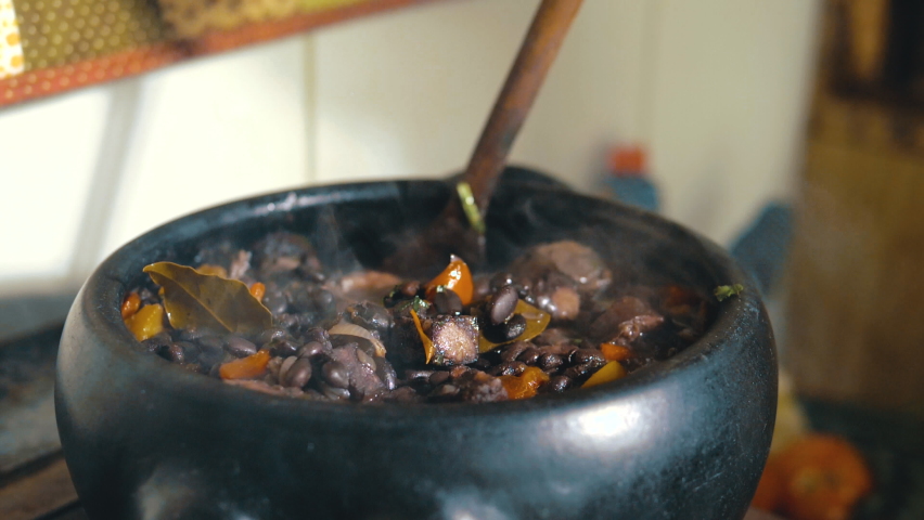 Cooking feijoada on a wood stove	 | Shutterstock HD Video #1081520285