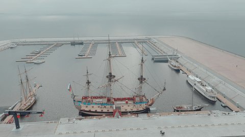 Russia, St. Petersburg, 14 October 2021: Aerial video filming of the new port Hercules with a replica of the old military frigate Poltava, the port next to the Lakhta center skyscraper