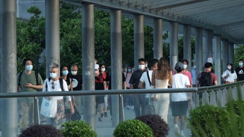 Hong Kong , China - 09 13 2021: Hong Kong - September 13, 2021: Unrecognized people wearing medical face masks in Hong Kong.